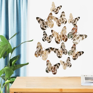 Detailed view of 12pcs golden 3D hollow butterfly wall stickers with intricate lace patterns