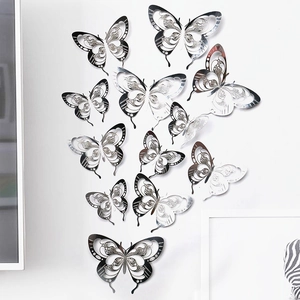 Detailed macro view of 3D hollow silver paper butterflies with intricate cutout designs