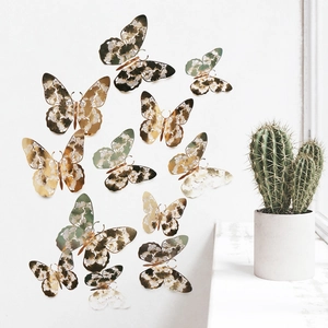 Detailed close-up of 3D hollow butterfly wall decals in gold and green vintage tones