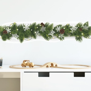Detailed Christmas wall sticker with pine branches, cones and snowflakes on white wall