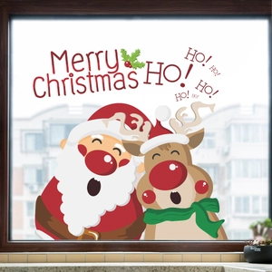 Detail of Merry Christmas window stickers featuring cartoon Santa Claus and reindeer on glass