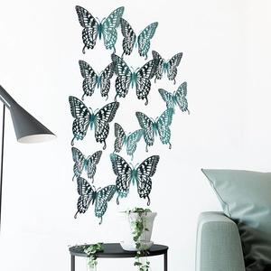 3D hollow teal butterfly wall stickers with laser-cut patterns on a white background