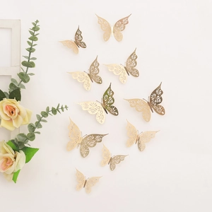 Detailed view of 3D gold hollow butterfly wall stickers with intricate laser-cut patterns