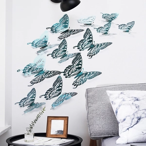 Detailed view of 3D hollow blue paper butterflies with intricate patterns on a bedroom wall