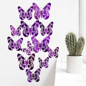 Detailed laser-cut purple butterfly wall stickers in varying sizes on a white wall decor