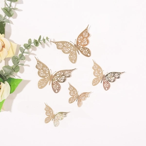 Detailed view of 5 golden hollow butterfly wall stickers with intricate floral patterns