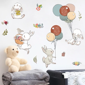 Cartoon rabbit wall stickers set with balloons and flowers for cozy nursery wall decor