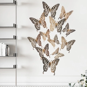 Detailed view of 3D gold hollow butterfly wall stickers with intricate laser-cut patterns