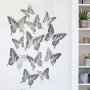 Macro detail of silver 3D hollow butterfly wall stickers with metallic reflective finish