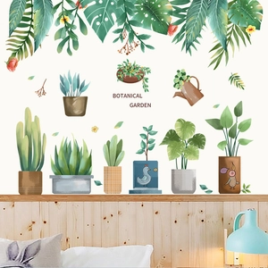 Detail of botanical garden wall stickers with cacti and hanging plants on a bed headboard