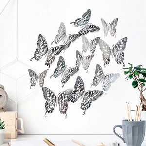 Detailed view of silver hollow-out 3D butterfly wall stickers in varied sizes and patterns