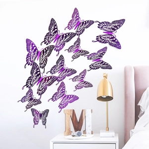 Detailed view of purple 3D hollow butterfly wall stickers on a minimalist white bedroom wall