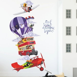 Detail of cartoon animal wall stickers featuring a lion pilot and red double-decker bus