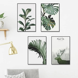 Set of 4 tropical plant and elk wall art prints with black frames in a modern living room