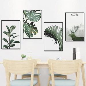 Minimalist black framed wall art set with tropical green leaves and forest elk silhouettes