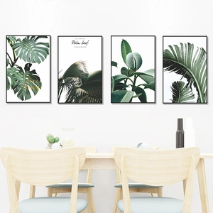 Set of 4 tropical monstera and palm leaf wall art prints with black minimalist frames