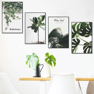 Minimalist green tropical leaves wall art set of four in black frames for home decor