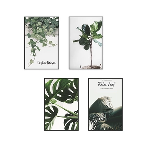 Set of 4 tropical plant wall art prints featuring ivy and palm leaves in black frames