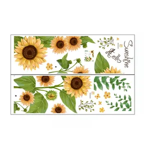 Detail of sunflower wall stickers with Hello Sunshine lettering and green floral motifs