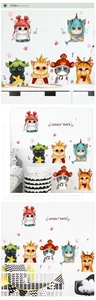 Detail showing cartoon cat wall stickers in a cozy kids room setting with DIY application