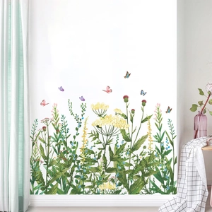 Garden style wall stickers with butterfly and wildflower meadow design on a white wall