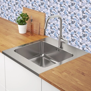 Kitchen backsplash tile stickers with blue and gray abstract wave patterns on wall
