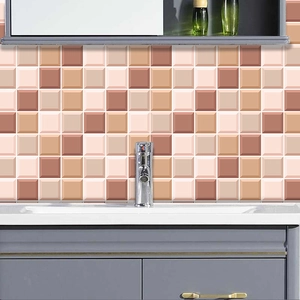 Detailed view of 3D orange and brown mosaic tile stickers in a bathroom backsplash setting
