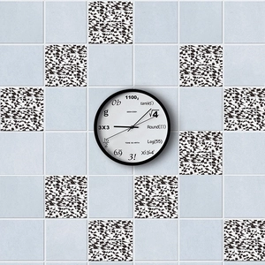 Detail showing self-adhesive black and white patterned tile stickers on a kitchen wall