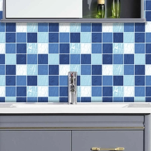Detailed view of blue checkered tile stickers applied to a modern bathroom wall surface