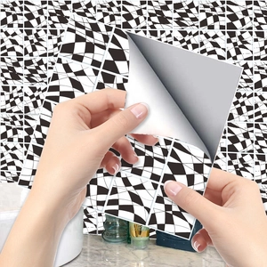 Close-up of waterproof black and white checkered self-adhesive tile sticker with easy peel backing