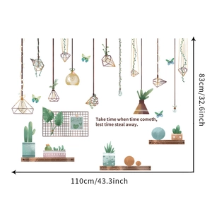 Detail of creative wall stickers with hanging lamps, potted plants and Dream quote