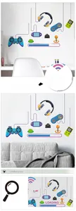 Detailed view of gamer zone wall stickers featuring game controllers and headphones