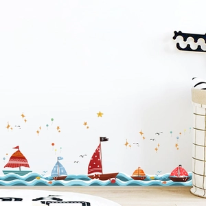 Cartoon nautical wall decals featuring colorful sailboats and blue ocean waves for nursery