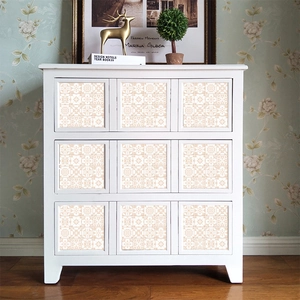 Self-adhesive mandala tiles applied on dresser drawers for a boho home decor look