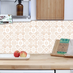 Self-adhesive tile stickers with beige and white geometric patterns in a kitchen setting