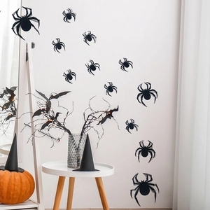 Set of black 3D spider wall stickers for Halloween home decor on a white background