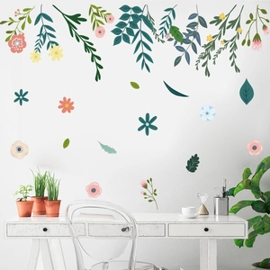 Minimalist creative wall decals featuring green leaves and colorful flowers for bedroom decor
