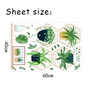 Flat lay of PVC wall stickers with monstera, ferns and gold hexagon frames on 40x60cm sheet