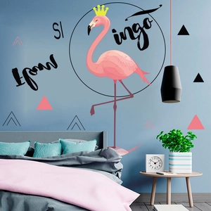 Detail view of pink flamingo wall stickers with geometric elements in a cozy bedroom decor