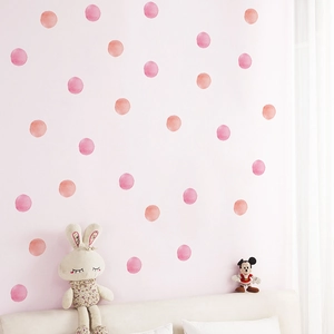 Pink and orange watercolor polka dot wall decals for cozy kids' room interior decor