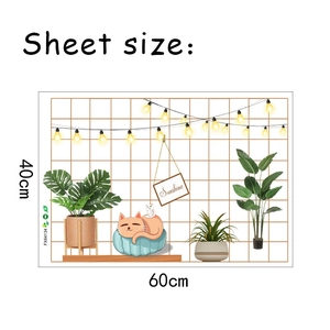 Wall sticker detail showing tropical plants and ginger cat on cushion with size 40x60cm