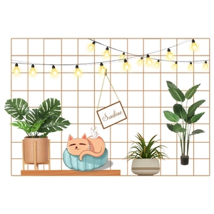 Brown wall grid organizer set with warm LED lights and artificial green plants decor