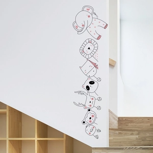 Detailed view of cute cartoon animal wall stickers featuring an elephant and lion on a white wall