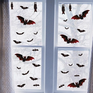 Halloween window stickers featuring black and red bat decals on glass for home decoration