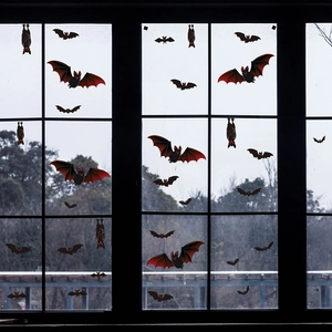 Halloween decorative window stickers featuring black and red bats in various flying poses