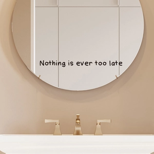 Inspirational 'Nothing is ever too late' wall decal sticker on a modern bathroom mirror