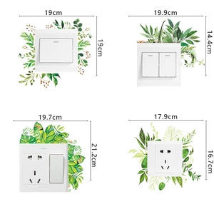 Detail view of four green leaf plant wall stickers for light switches with measurements