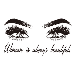 Detail showing elegant long eyelashes wall decal with Woman is always beautiful quote