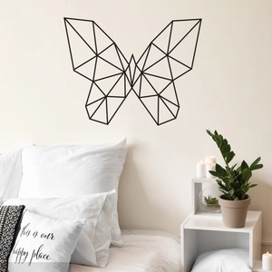 Minimalist black geometric butterfly wall sticker set in a cozy modern bedroom setting