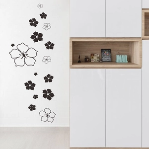 Minimalist black and white flower wall stickers shown on a modern white brick interior wall